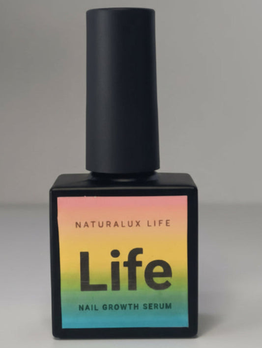 Nail growth serum bottle with gradient label on a gray background