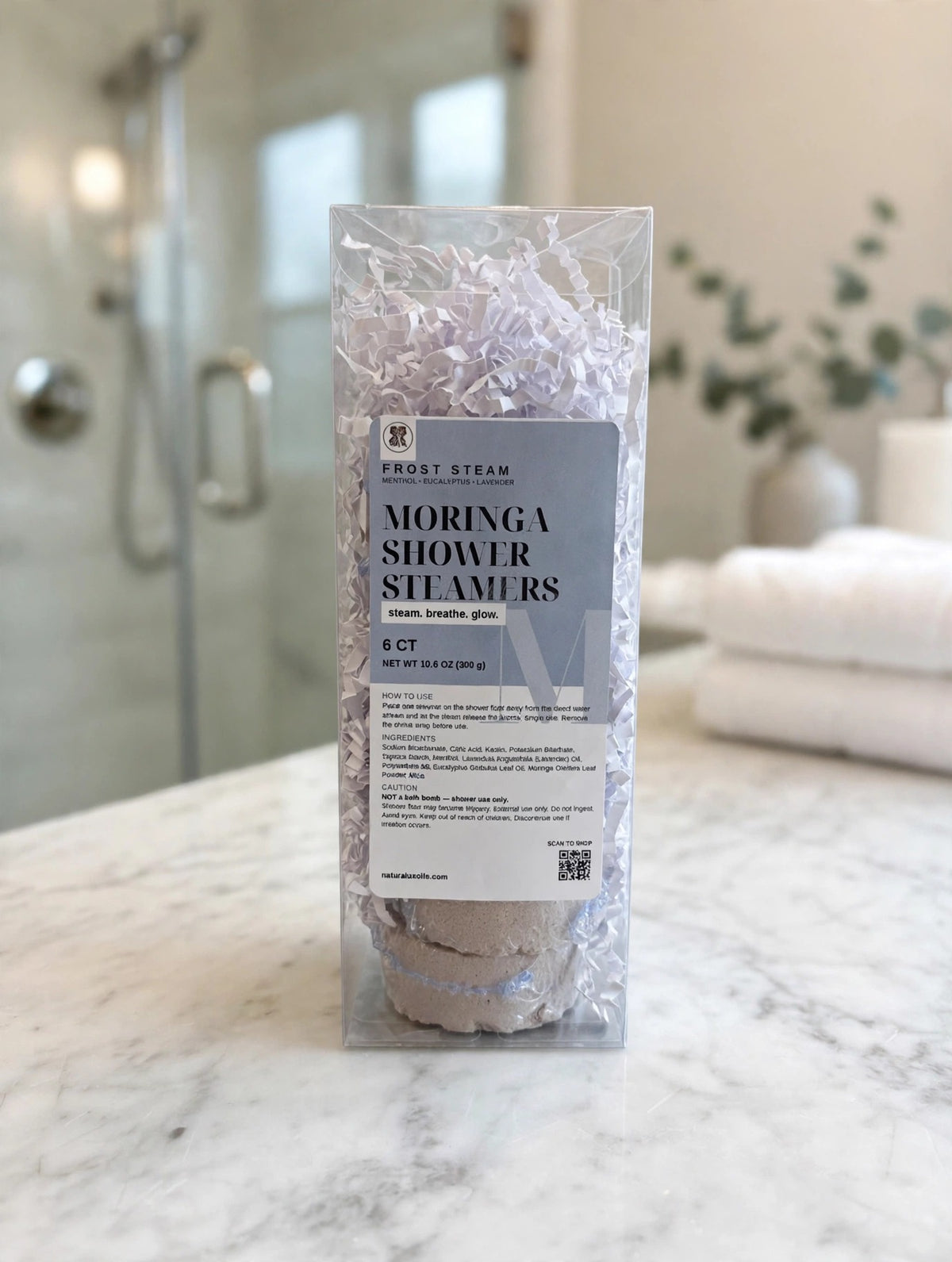 Frost Steam box on a marble bathroom counter
