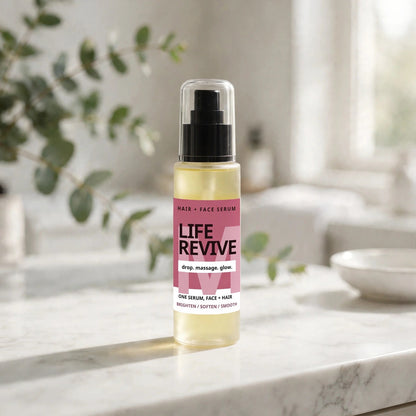 Life Revive Hair and Face Serum bottle on a bright bathroom vanity