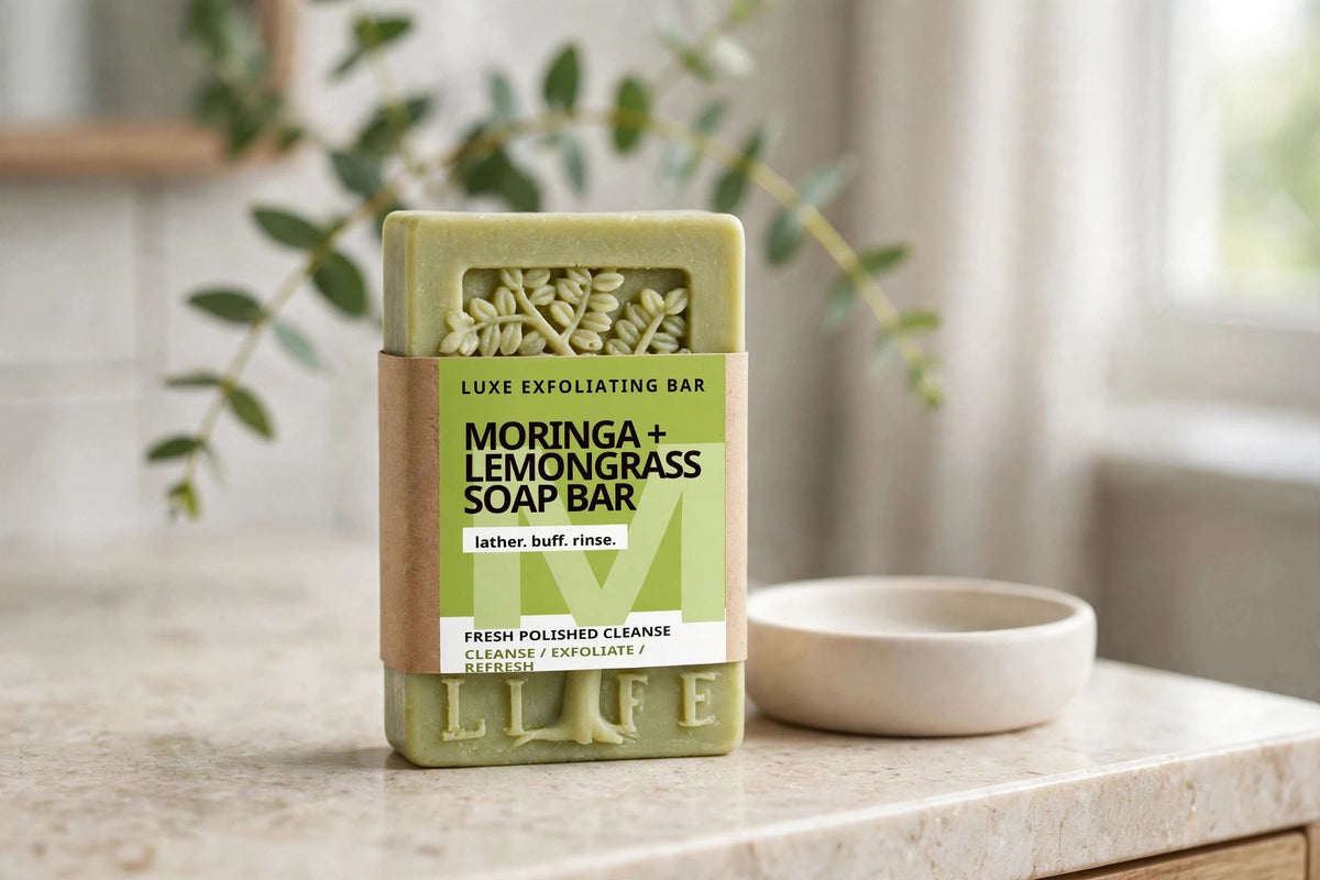 Moringa and Lemongrass Soap Bar on a bathroom vanity beside a ceramic soap dish
