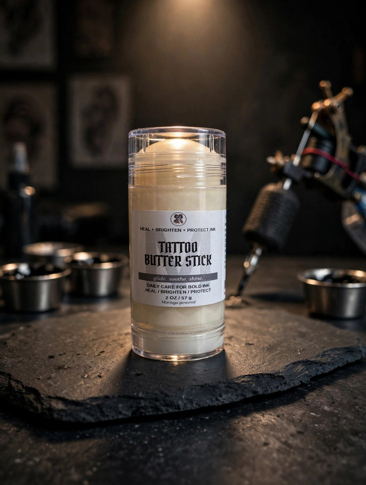 Tattoo Butter Stick on a dark slate counter in a tattoo studio